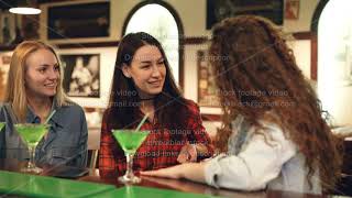 Cheerful female friends are socializing in fancy bar. Attractive women are chatting, laughing and screenshot 3