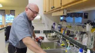 Using a hand drill to peel an apple