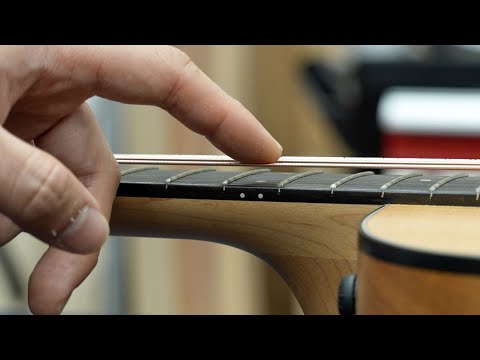 Repair an extremely high action Taylor guitar - YouTube