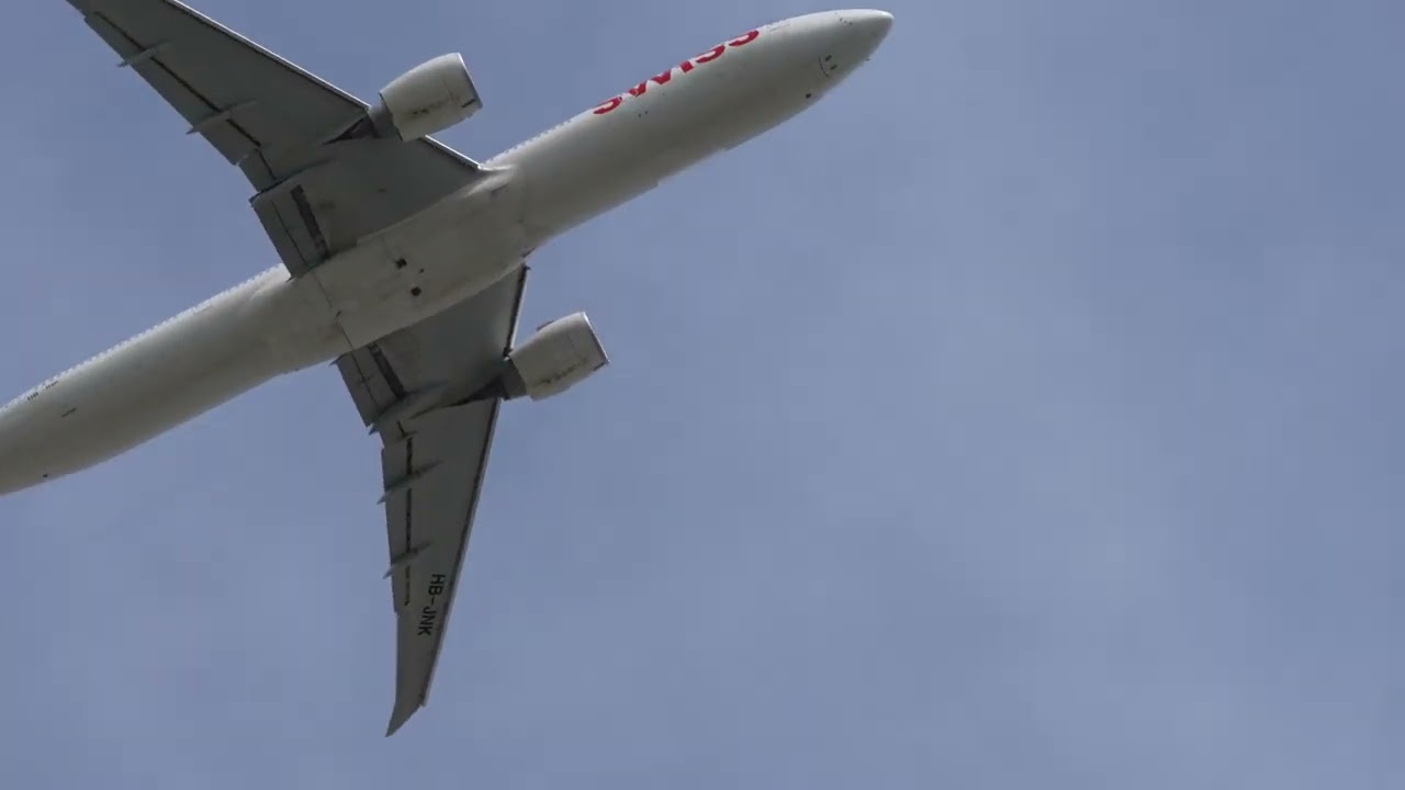 Zurich Airport Swiss airplane Boeing 777-300ER HB-JNK taking off