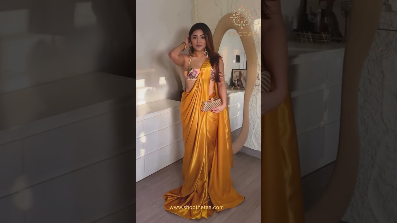 Khushi Karki in our bold hand-embroidered bralette blouse paired with a liquid gold pre-draped sares