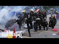 Hong Kong protests: fights break out and police fire teargas