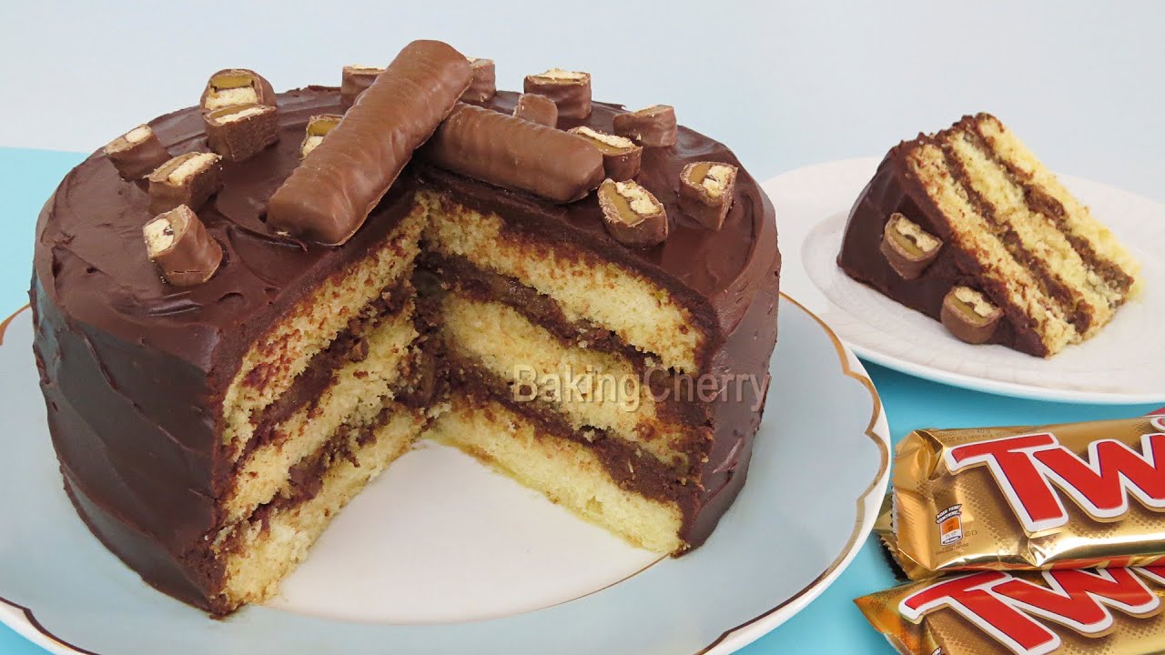 Twix Cake! A delicious vanilla cake with chocolate, caramel, and Twix