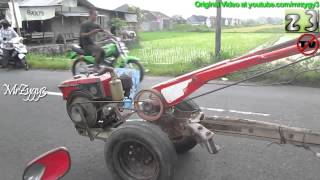Man Ridding Yanmar Two Wheel Hand Tractor