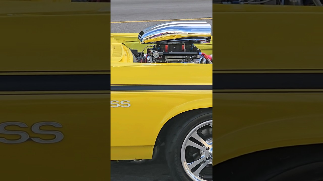 all motor 572 cubic inch V8 Chevy Nova SS custom cruises by Hard Rock at Cruisin the Coast car show