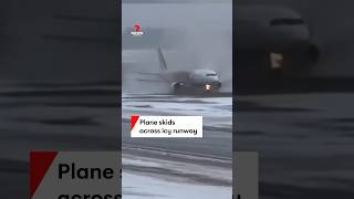 Plane skids across icy runway