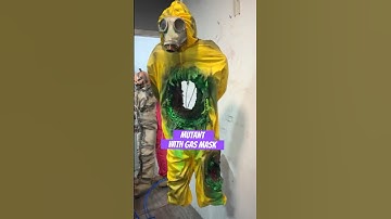 Animatronic Halloween Toxic monster with gas mask in secret laboratory, hazmat suit, life size