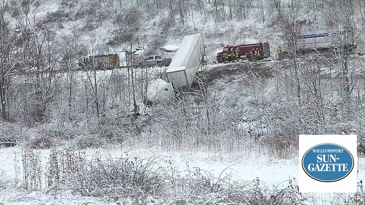 Tractor-trailer driver escapes injury after plunging down embankment 