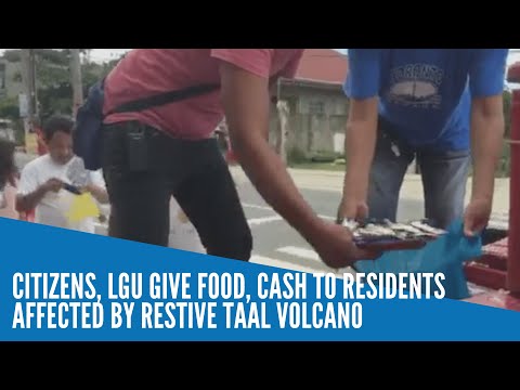 Citizens, LGU give food, cash to residents affected by restive Taal Volcano