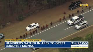 Hundreds Gather In Apex To Greet Buddhist Monks On Their Walk For Peace