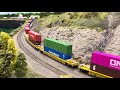 Coshocton Model Railroad Club - Intermodal train passing by mountain ho scale