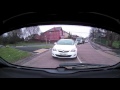 Bmw X5 overtakes dangerously on roundabout.