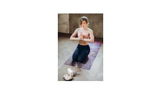Woman Meditating With Candles and Incense