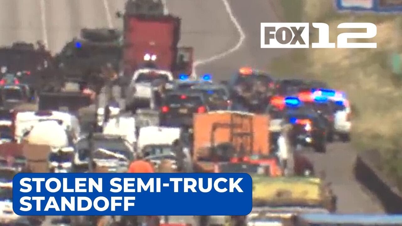 Man in custody after stolen semi-truck standoff, ramming police car ...