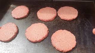 The Perfect Griddle Blackstone Making Burgers and Dogs