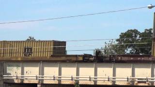 CSX Intermodal Train Powers By on Raised  Tracks