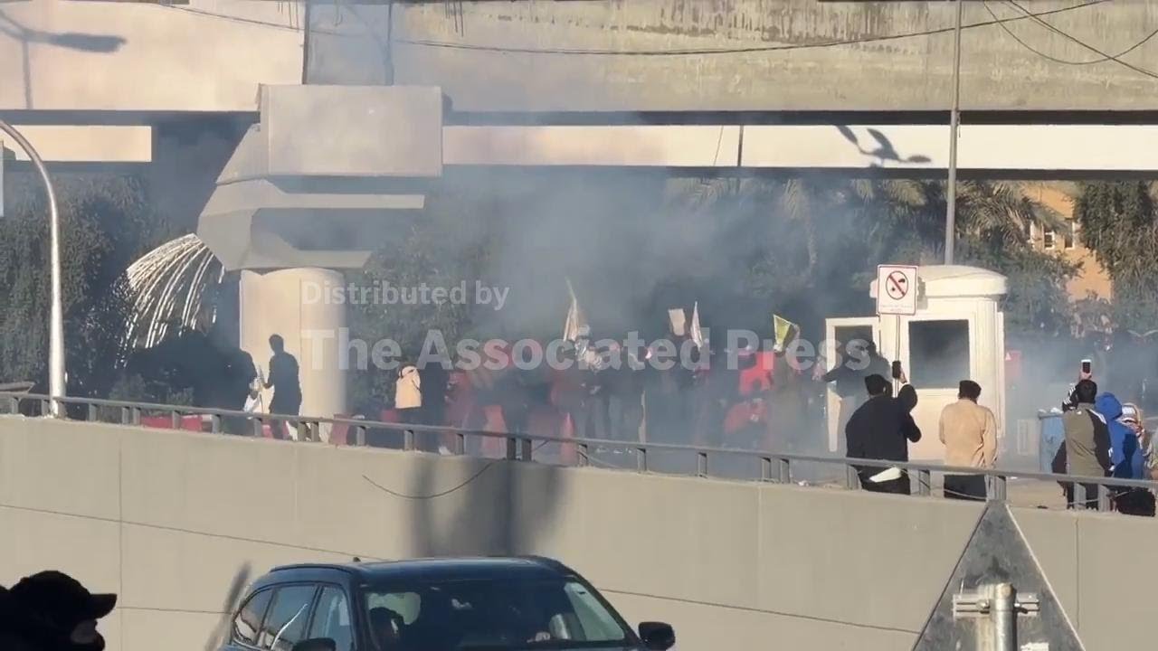 Protesters in Baghdad mourn Khamenei and clash with anti-riot police near US embassy