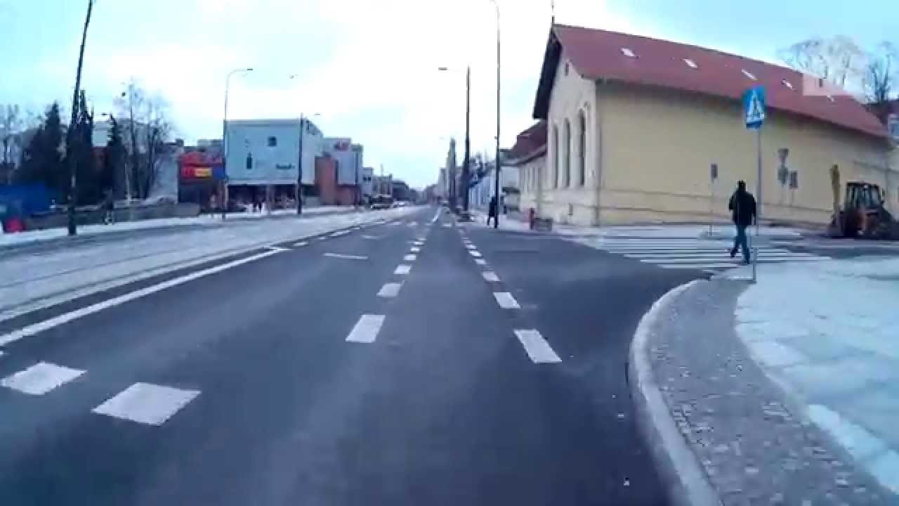 Olsztyn. Przejazd rowerem pasami ruchu dla rowerów oraz śluzą rowerową na al. Piłsudskiego