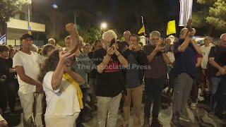 Israelis blow shofars and read out names of hostages during protest outside presidents residence