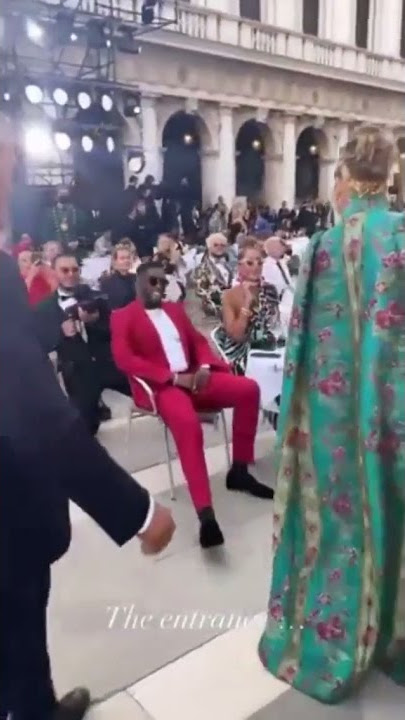 Diddy watching Jlo arrive at Dolce & Gabbana fashion show in Italy