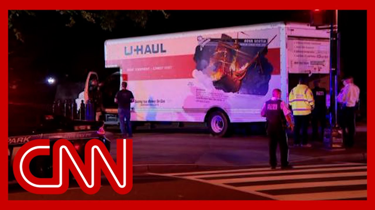 ⁣Watch moment truck carrying apparent swastika flag crashes into barrier near the White House