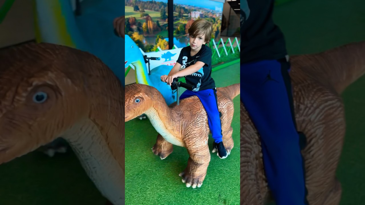 Kids riding dinosaur with my baby brother