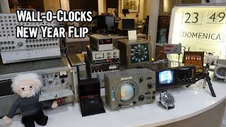 Wall of weird vintage electrical and electronic clocks new year flip