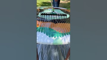 He uses a yard rake to refurbish the table!