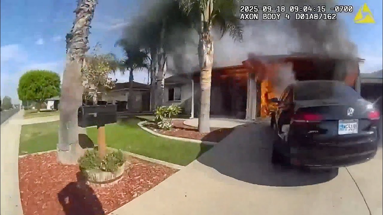 Police officers rescue woman from burning home - YouTube