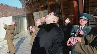 Kim Jong-Un watches as North Korea launches long-range rocket 'carrying satellite'