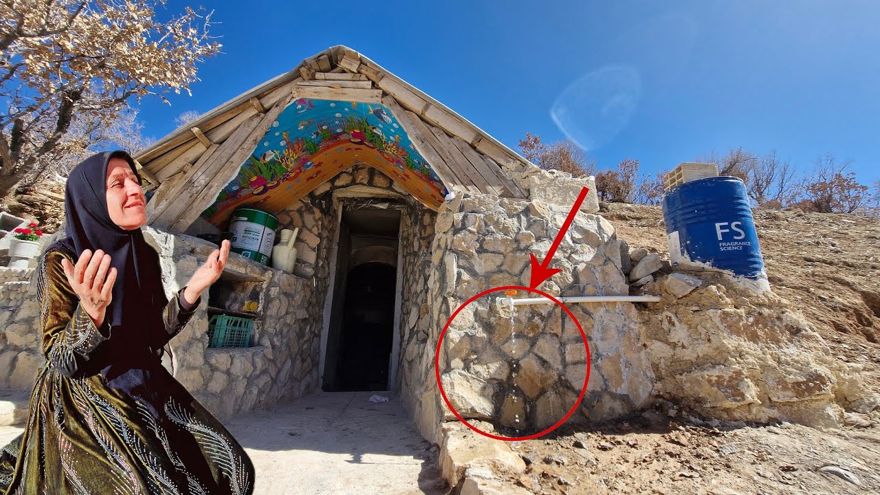 A single mother's tears of joy as she sees water flowing next to her cave shelter