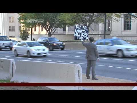 unemployed-phd-takes-job-hunt-to-busy-dc-streets