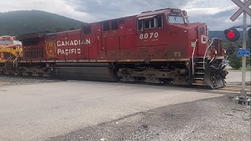 Big mixed freight rumbles through Crowsnest Pass, Alberta