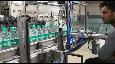 Fully Automatic 90 BPM Filling Labeling Shrink Wrapping Machine supplied in Kolkata M/s. B.S. Aqua