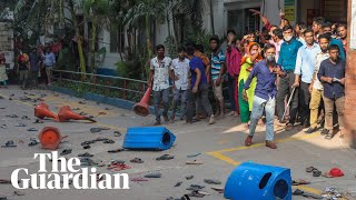 Three dead as police clash with garment workers in Bangladesh demanding a wage increase
