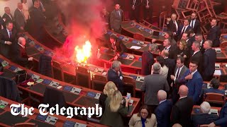 video: Watch: MPs set off smoke bombs and light fire in Albanian parliament