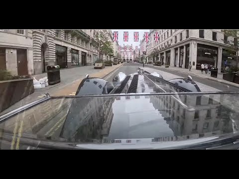 Post coronation tour of Central London in a 1937 SS Jaguar 100