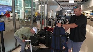 Travelers endure flight delays, cancellations at the end of busy holiday weekend