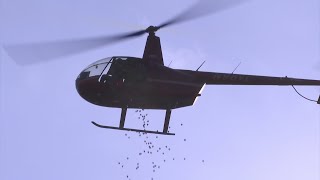 Rockford church drops 43K Easter eggs from helicopter