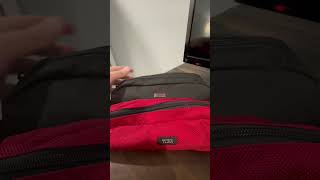 Red and black Tumi Bags