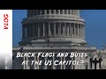 What are the black flags at the US Capitol and why are there so many buses around the Congress?