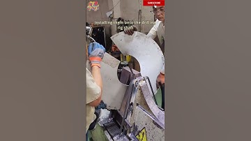 The workers are making spiral blades and installing them onto the drilling rig shaft