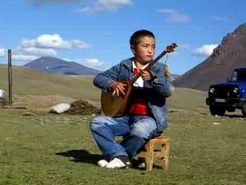 Kazak boy playing dombra