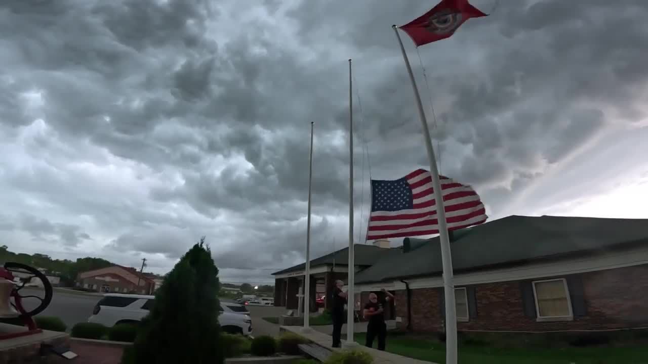 Firefighters rush to save flags in severe weather