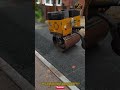 The Mecalac MBR71 walk-behind roller tool used for compaction of asphalt and granular materials