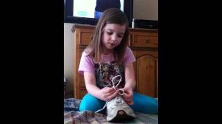 Abby ties her shoes!