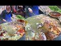 A Chinese women Cooked Free Meals for the elders on the Street in a Downtown Village