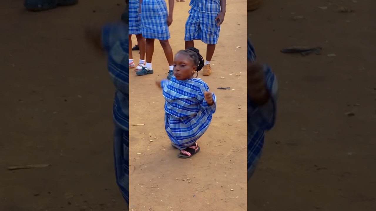 Aunty Ajara and Sunday Jatto dancing on the set of local school   