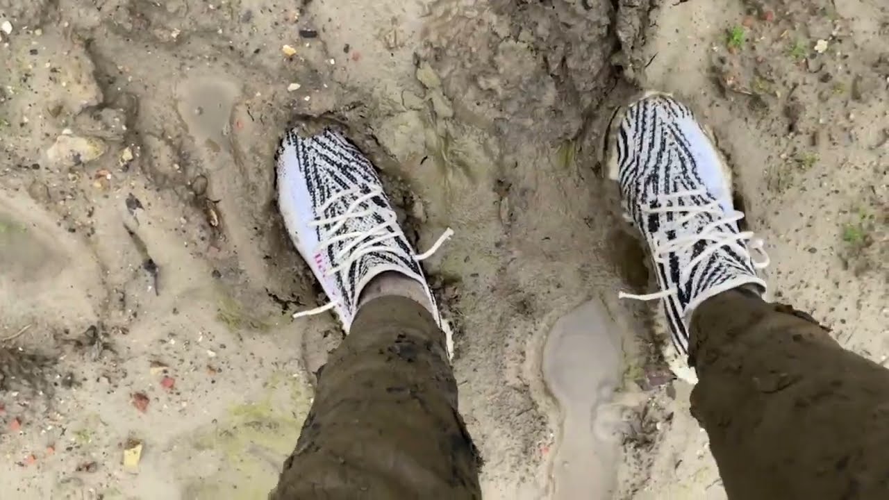 Rolling in mud with grey nike tech fleece and white yeezy zebra