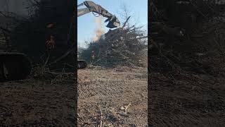 big wood pile #fire#lifeisbutadream #excavator